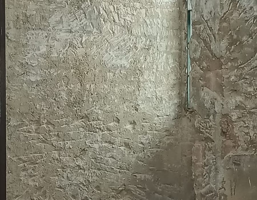 Exposed hacked wall with tools during JBC demo works