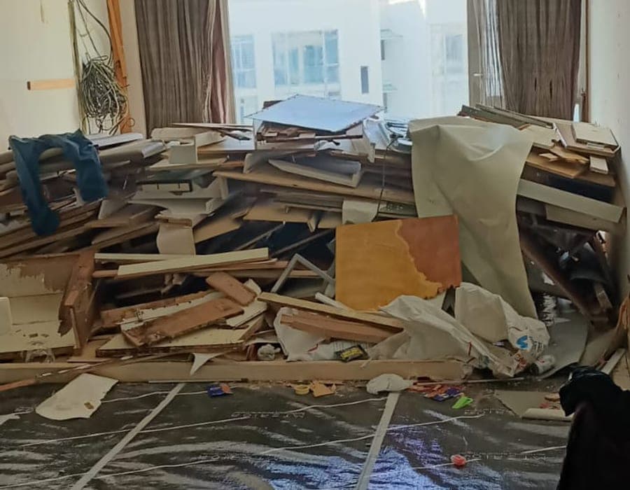 Protected work area with dismantled materials and covered floor