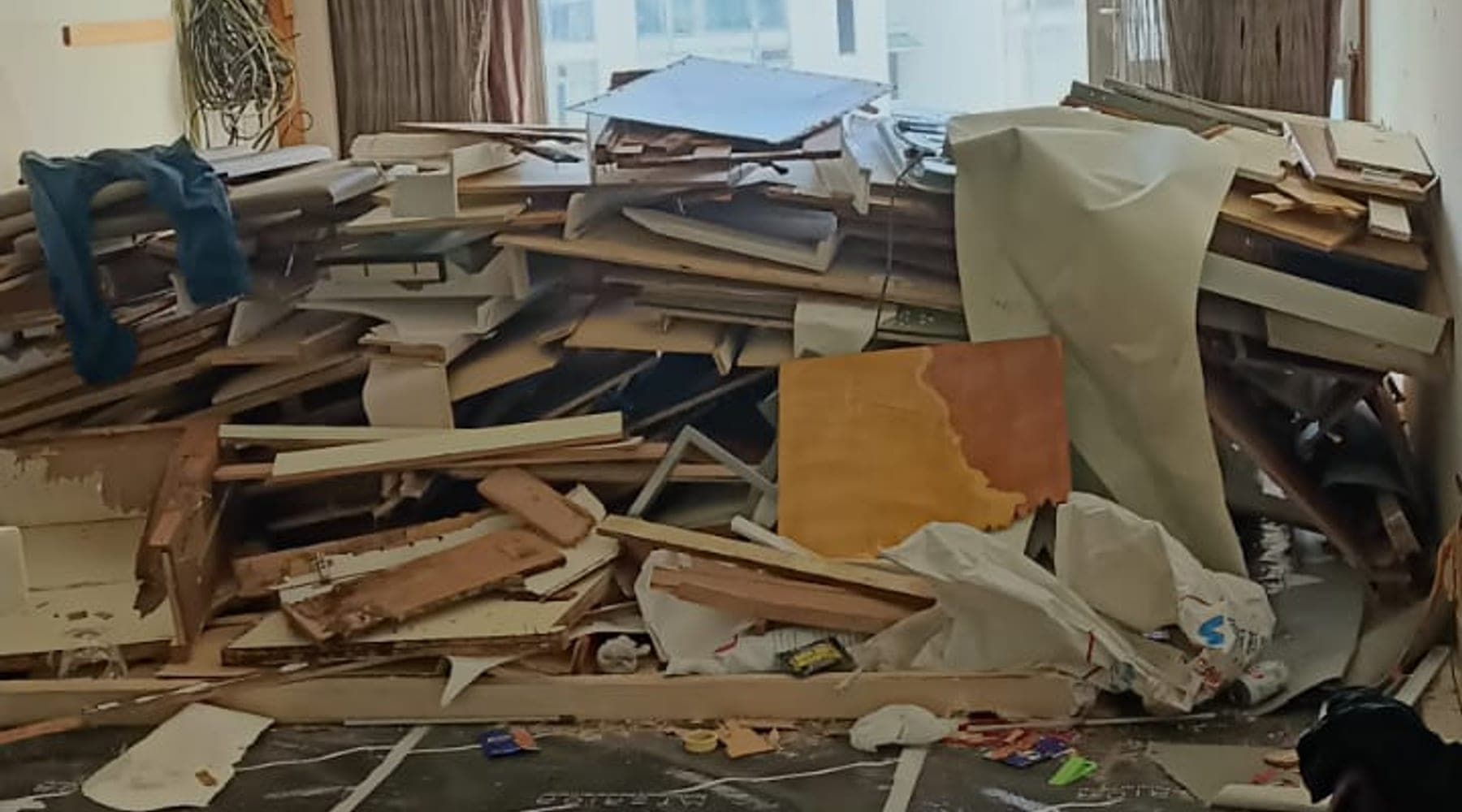 Protected demo work area with debris and floor covering